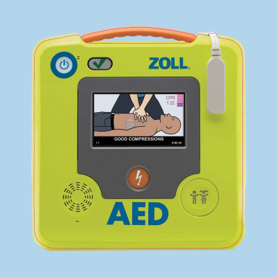 A Zoll AED on a light blue background, showing a CPR instructional display with a compressions guide on the screen.